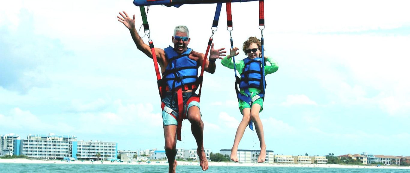 Picture of doctor and son parasailing